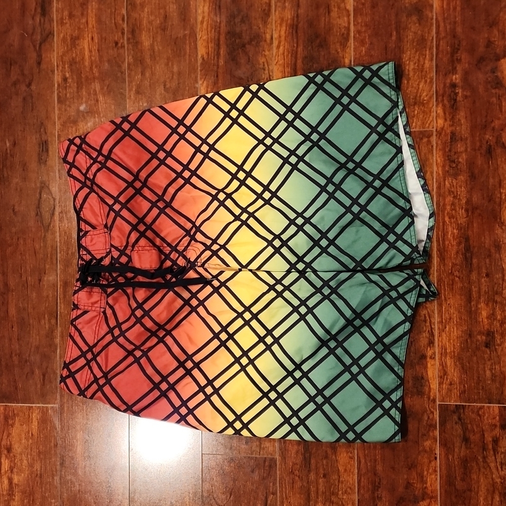 Hang Ten swim shorts. Lined, tie and Velcro closure. Pocket back